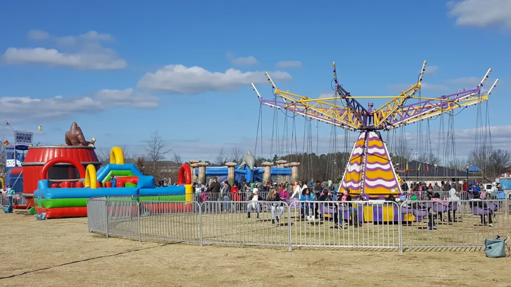 The Way Out Swing and numerous inflatables at a winter festival